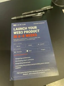 Photo: Nomium flyer at BTC Prague 2026, launch your Web3 product in 6-8 weeks